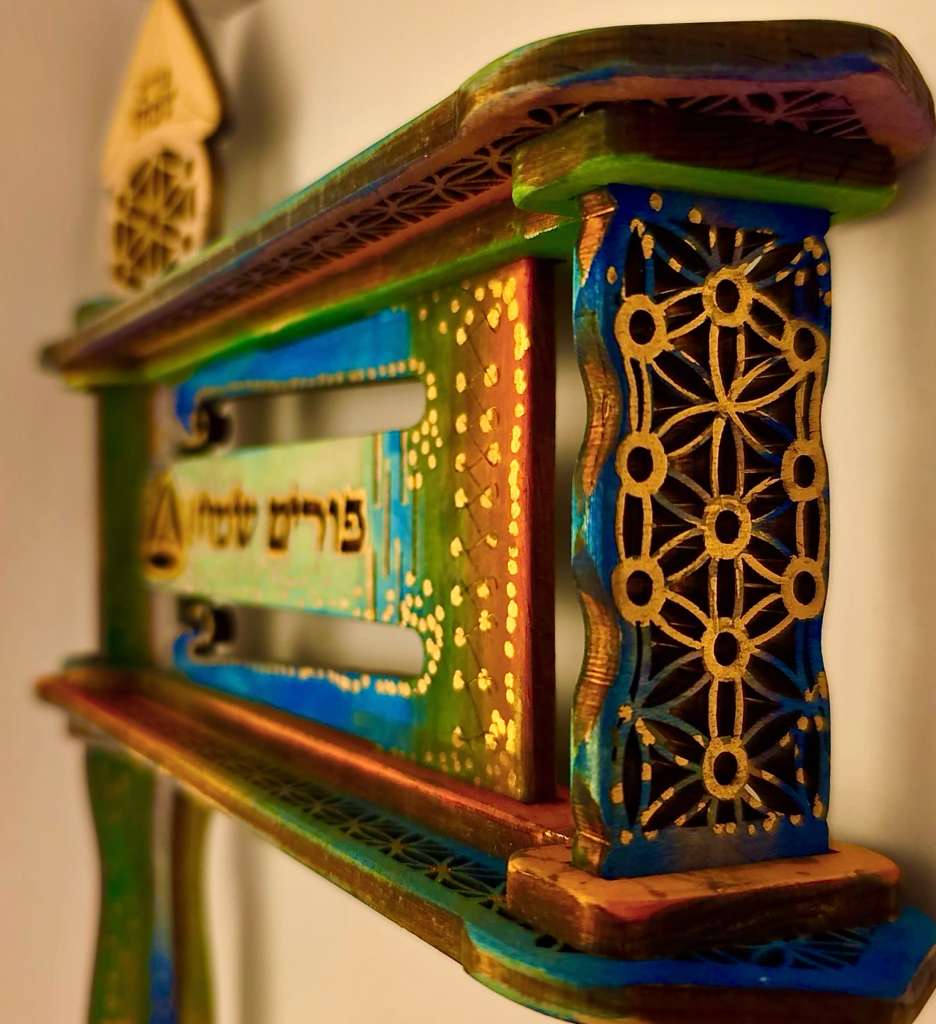 Flower of Life geometry side panel close-up in greens, blues, golds and purples