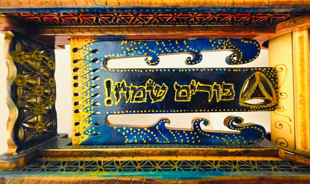 Interior view showing פורים שמח with wave cutouts, deep blue finish and hamantash symbol