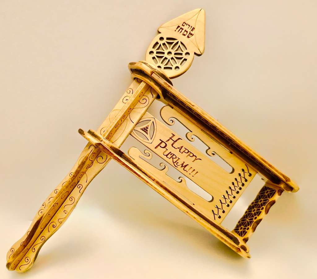 Unpainted wood gragger showing raw laser-cut craftsmanship